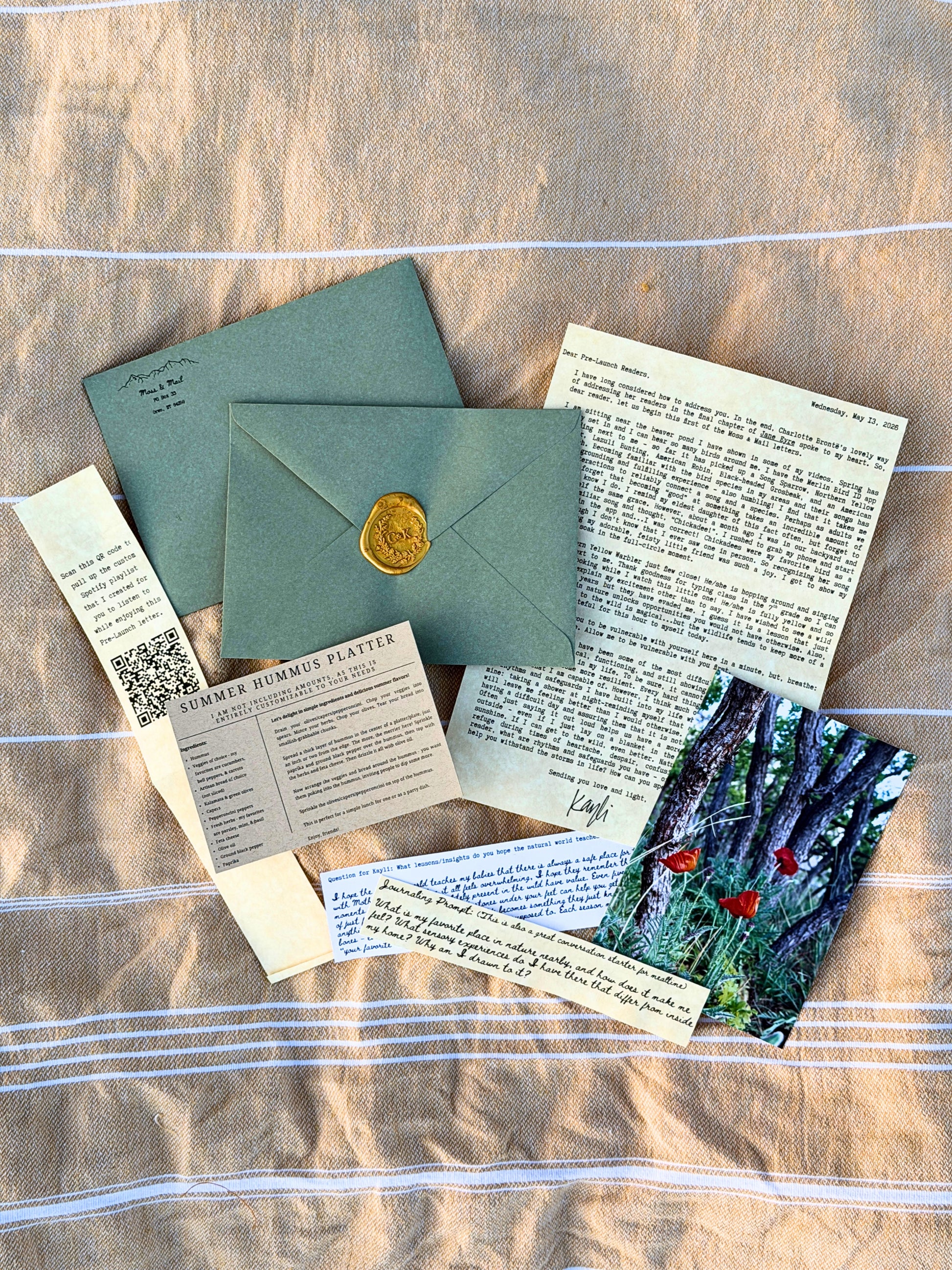 Moss & Mail monthly letter subscription — handwritten letter, wax seal envelope, nature photo, and extras